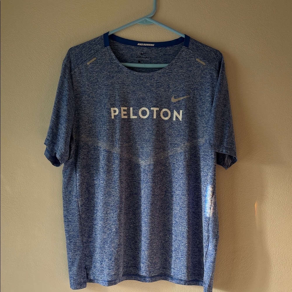 Nike running Peloton shirt
Size L
Color heathered blue